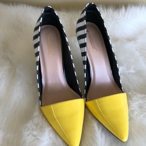 A beautiful black and white and yellow dress shoes